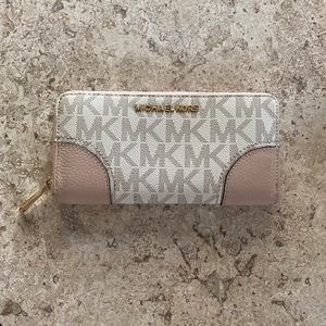 Pink and beige Michael Kors zip accordion wallet